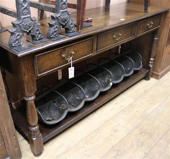 A reproduction oak dresser base, fitted three drawers and pot shelf, W.153cm
